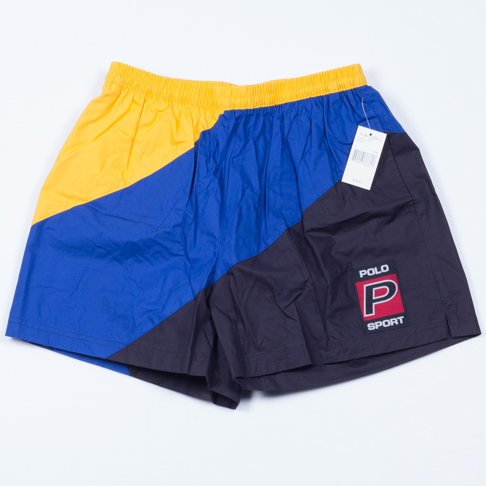 노랑·파랑·남색 패널과 POLO P SPORT 표장이 있는 쇼츠